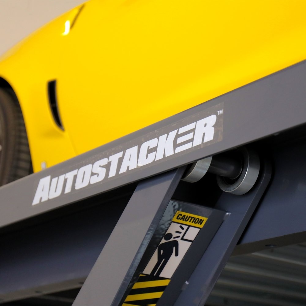 Autostacker parking lift with yellow car