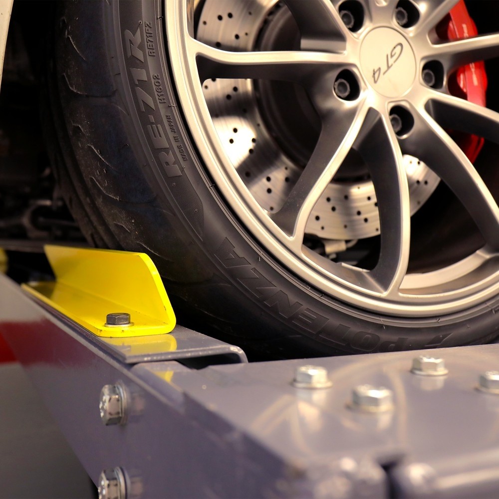 Wheel safety stop on Autostacker parking lift